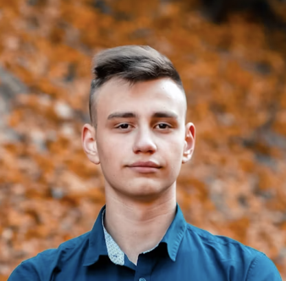 Young man in blue shirt outdoors
